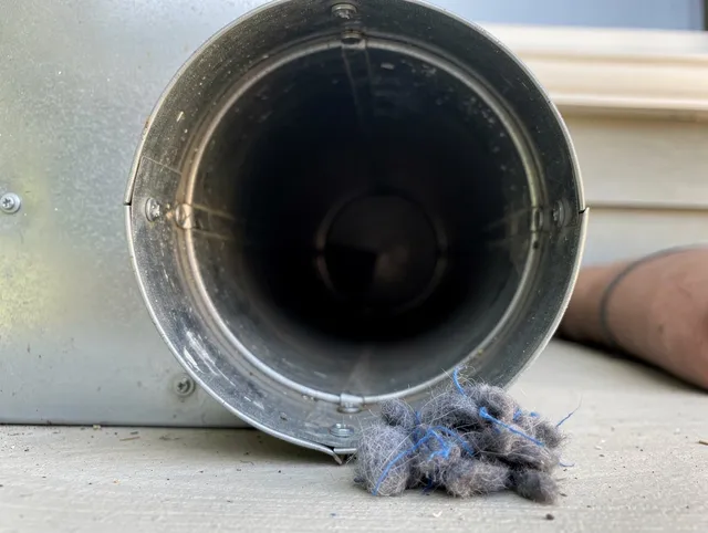 Bellflower Dryer Vent Cleaning technician using specialized equipment to clear severe dryer vent blockage in Bellflower
